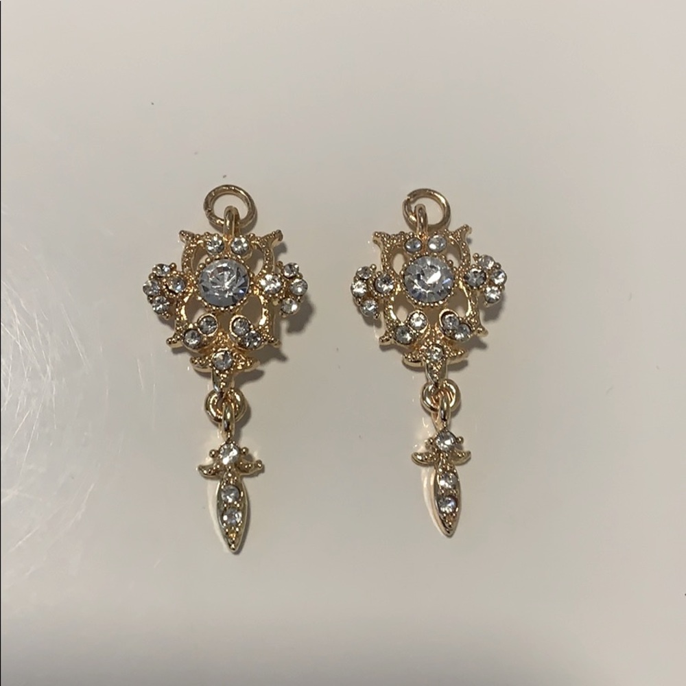 2 gold charms with crystals